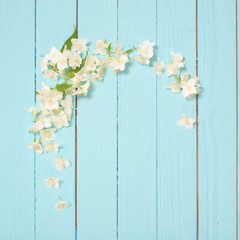 white flowers on идгу wooden background