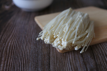 Closeup of an Enoki muchroom. Enoki, also known as velvet shank, is a species of edible mushroom in the family Physalacriaceae