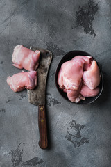 Chicken meat on grey background, flat lay