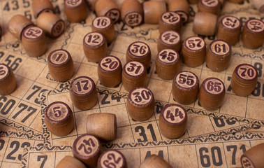 Old Wooden Lotto barrels with playing cards. Table Game Bingo