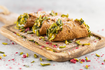 A plate of cannoli served on a plate