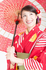 番傘を持った浴衣姿の女性