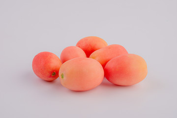 Fresh red Seeda tomatoes on white background, Thai tomatoes