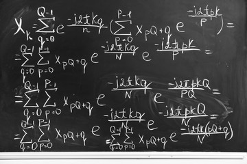 Blackboard with written maths formulas