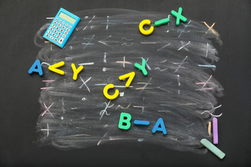 Mathematical symbols and letters on blackboard
