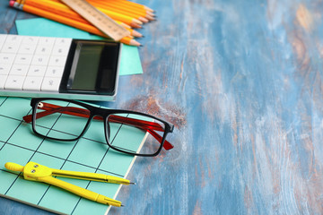 Set of school stationery on wooden background