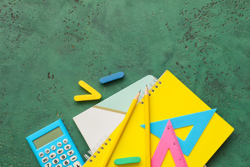 Set of school stationery on color background