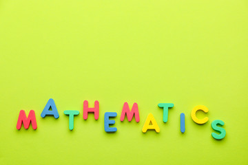 Word MATHEMATICS on color background