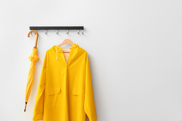 Raincoat and umbrella in hallway