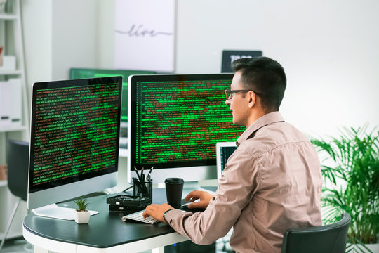 Male programmer working in office