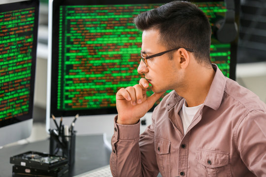 Male programmer working in office