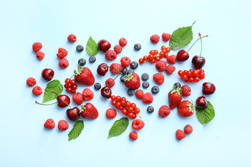 Tasty fresh berries on color background