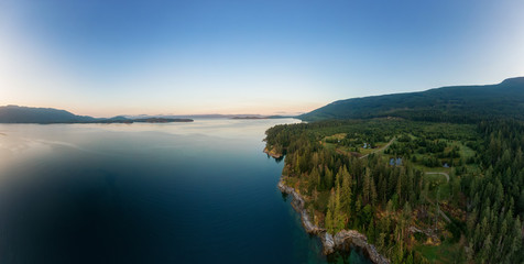 Aerial Panoramic View of Mermaid Cove during a colorful summer sunrise. Taken in Saltery Bay, Sunshine Coast, British Columbia, Canada.