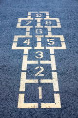 Hopscotch game on asphalt in the school yard playground