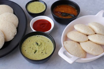 South Indian breakfast dish Idli with Coconut Chutney and sambar. Idly sambar. over light background with copy space.