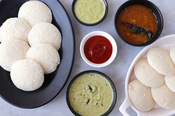 South Indian breakfast dish Idli with Coconut Chutney and sambar. Idly sambar. over light background with copy space.