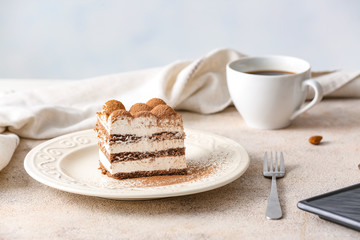 Plate with tasty tiramisu on table