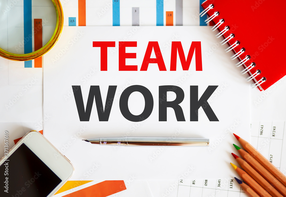 Poster word writing text team work on notepad. business concept with office tools on the chart background