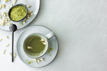 green matcha in a gray ceramic cup
