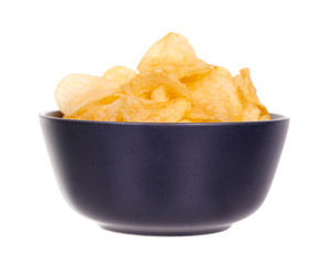 Golden potato chip in dark bowl, isolated on white background.