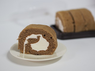 Coffee Yam Roll Soft and fluffy bread stuffed with cream on white plate