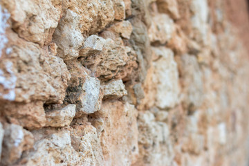 uneven stones wall side texture with blur to background
