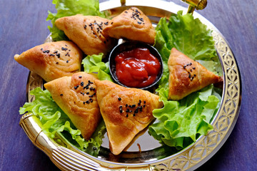 Samsa or Sambousak an oriental meal to be stuffed with minced meat, cheese or vegetables. The national dish of Uzbekistan is samsa with greens. Tasty, healthy, spring dish.