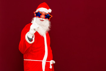 look out! Winter December sale and discount! cheerful excited stylish funny man with stars glasses white beard