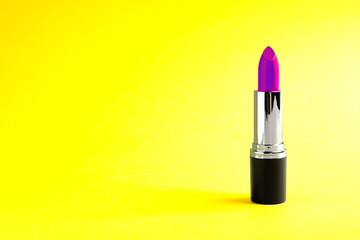 Bright lipstick on yellow background. Space for text