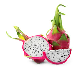 Delicious cut and whole dragon fruits (pitahaya) on white background