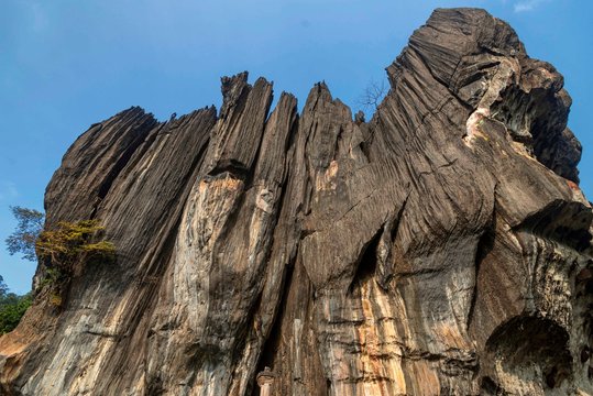.The huge rock is composed of solid black, crystalline karst limestone in a tourist place Yana Rocks this is an old stone formation with caves inside. Karnataka. India. Indian tourism concept