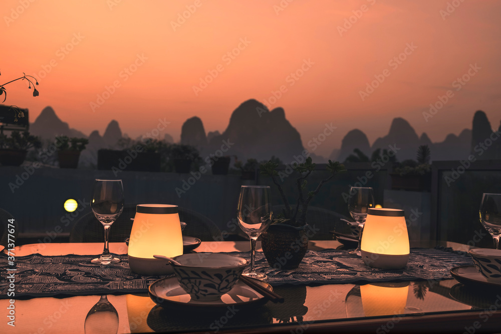 Wall mural outdoor rooftop dinner set in the dusk