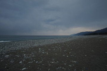 Overcast sky with dark cloud and sea in windy day.
