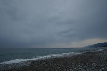 Overcast sky with dark cloud and sea in windy day.