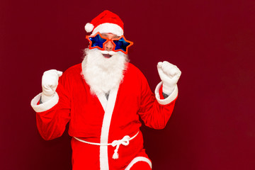 Holly jolly x-mas, confidence, magic, triumph concept. Cool funny playful biddle aged man shows win gesture