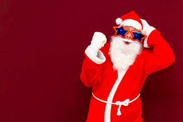 Holly jolly x-mas, confidence, magic, triumph concept. Cool funny playful biddle aged man shows win gesture
