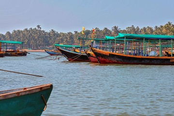 Naklejka na ściany i meble .12/14/2019 India. Maharashtra, Malvan. Traditional wooden fishing and tourist boats in the bay near Sindhudurg Fort