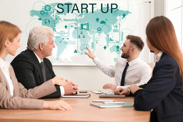 Business trainer giving lecture in conference room