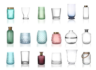 Set of empty glass vases on white background