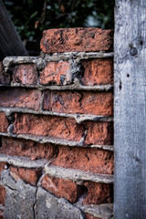old ruined brickwork and a surface of vintage wooden boards