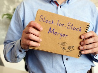 Stock-for-Stock Merger sign on the piece of paper.