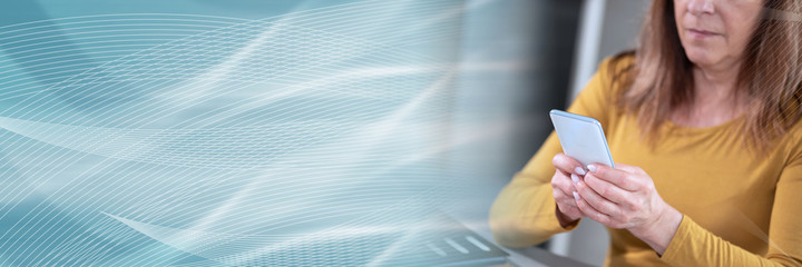 Woman using her mobile phone; panoramic banner