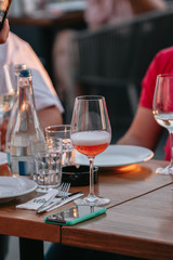 Glasses of white and pink sparkling wine on the table at the restaurant. Special wine tasting.