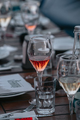 Glasses of white and pink sparkling wine on the table at the restaurant. Special wine tasting.