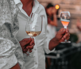 Glasses of white and pink sparkling wine on the table at the restaurant. Special wine tasting.