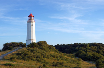 Fototapeta na wymiar Vintage Lighthouse in the north of the holiday island Hiddensee in Germany 