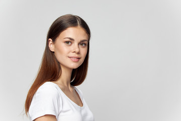 Obraz premium girl in white t-shirt brunette smile model isolated background Copy Space