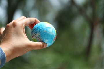 hand holding globe