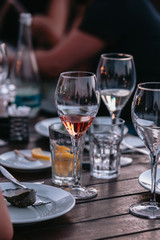 Glass of white sparkling wine at a summer tasting in the hand of a model.