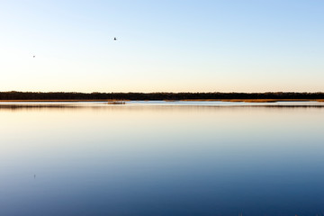 Sunrise over the calm lake